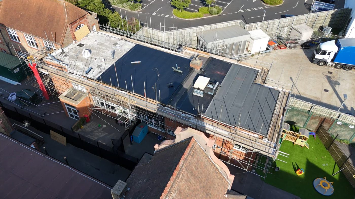 Edge protection guardrails around a flat roof perimeter